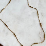 Gold Bar Chain Necklace with 18K gold plated stainless steel chain on marble background