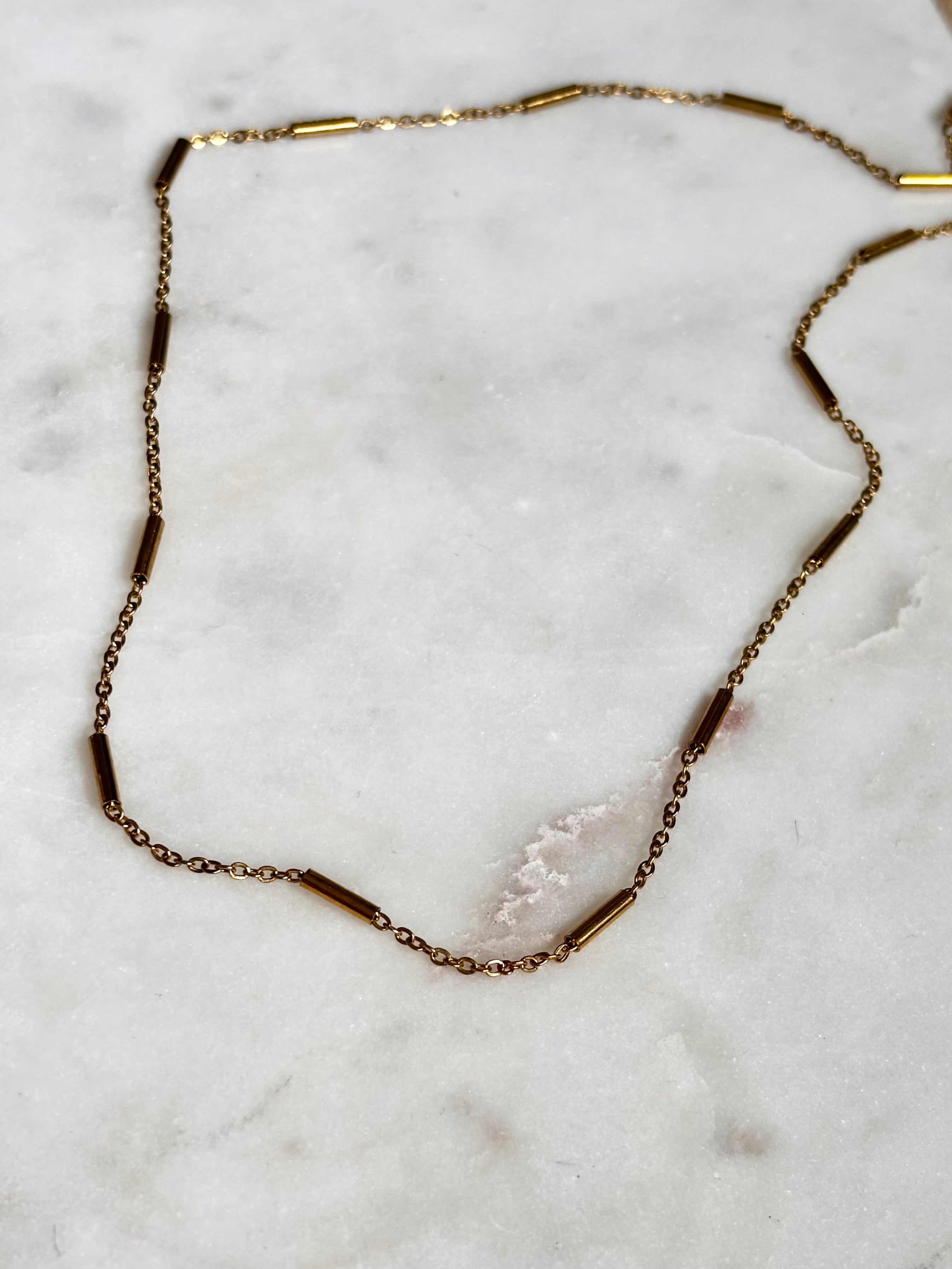 Gold Bar Chain Necklace with 18K gold plated stainless steel chain on marble background
